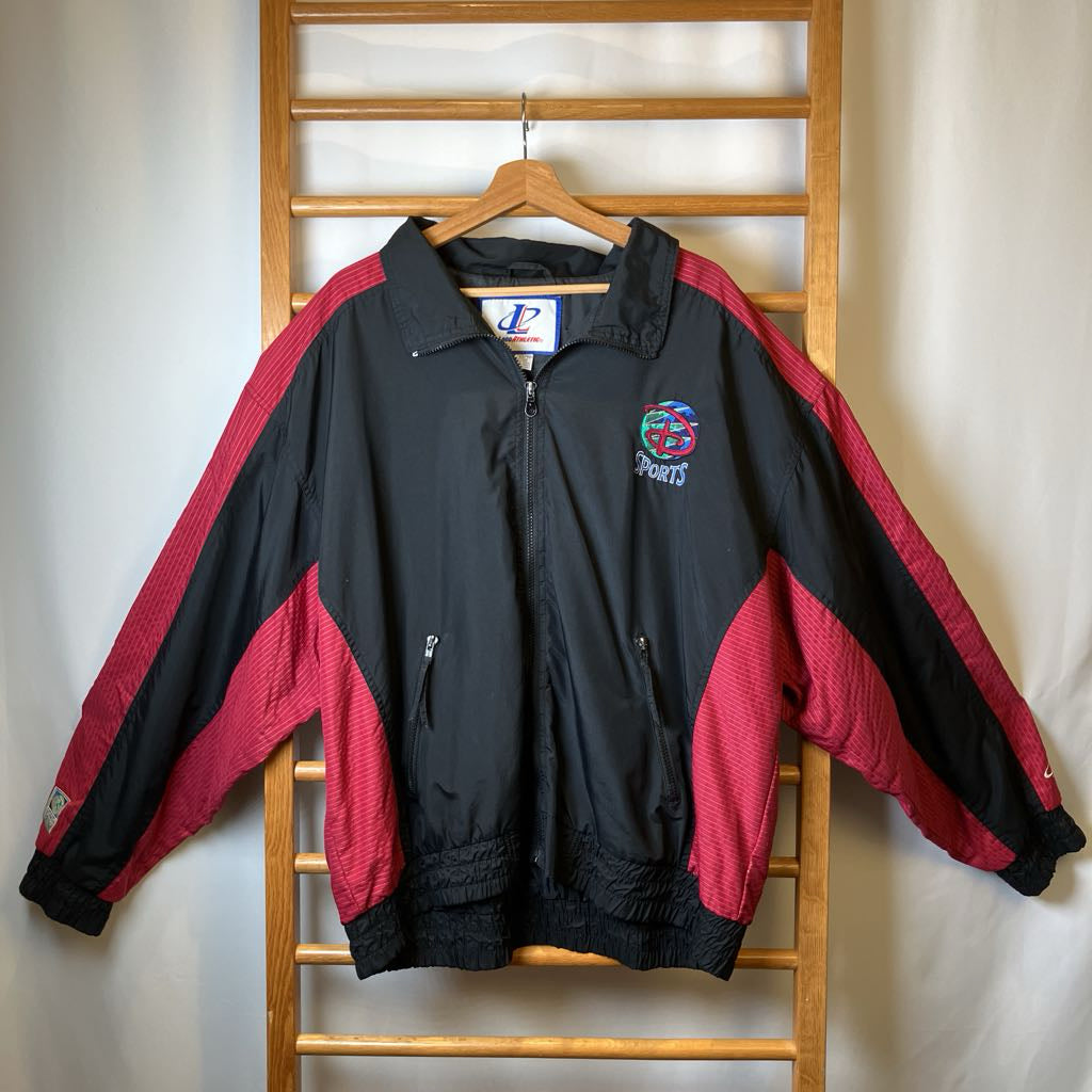 Black and red jacket with sports logo on a wooden rack