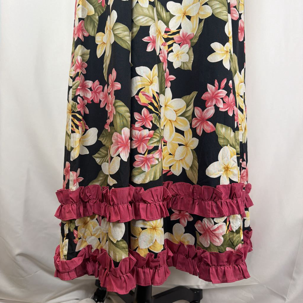 long floral dress against white background with pink ruffles