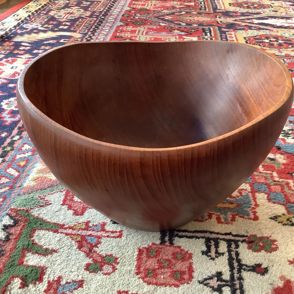 Wooden bowl on a patterned rug