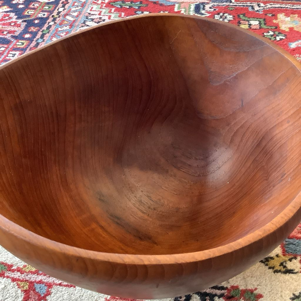 Wooden bowl on a patterned rug