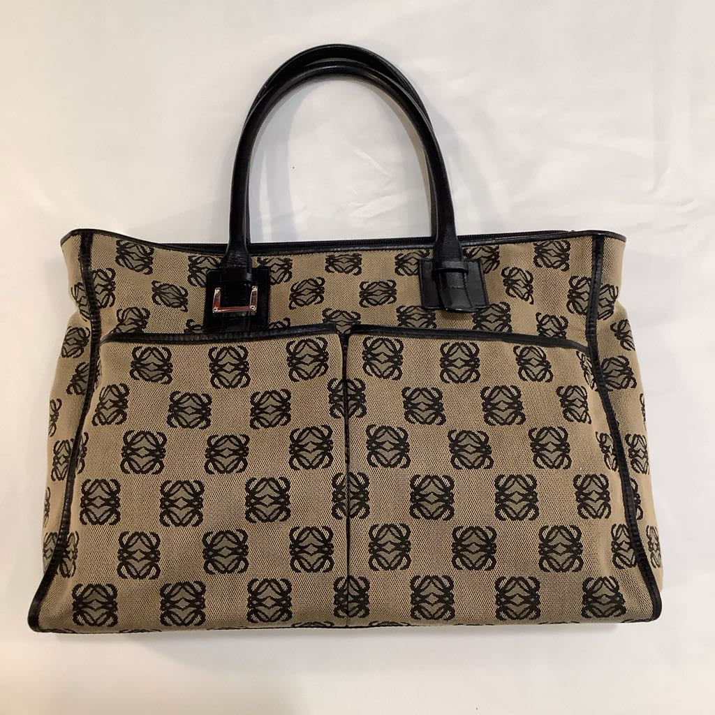 Beige handbag with black pattern on a white background