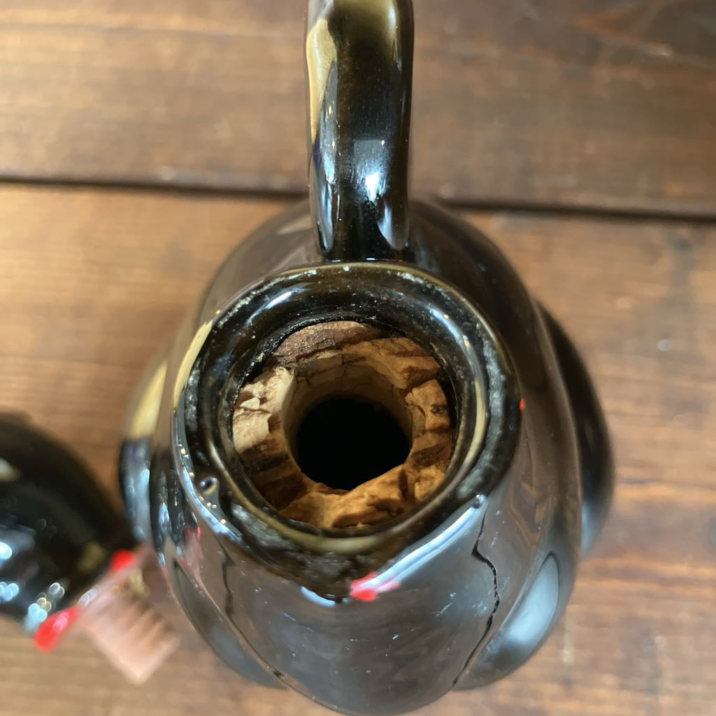 Close-up of a black ceramic teapot on a wooden surface