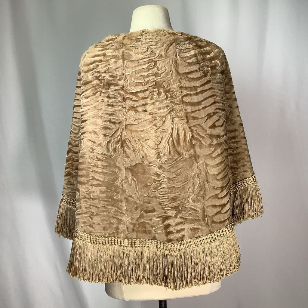 Textured beige jacket with fringes on a mannequin against a plain background