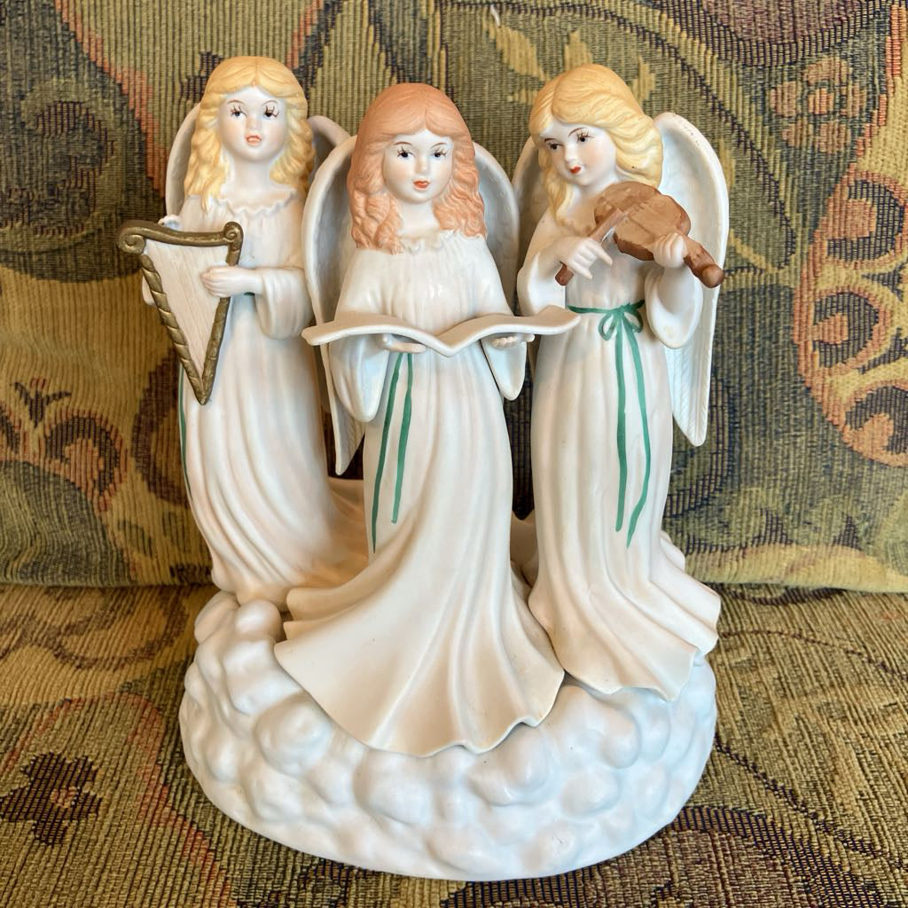 Decorative ceramic figurine of three feminine angels with musical instruments on a cloud base