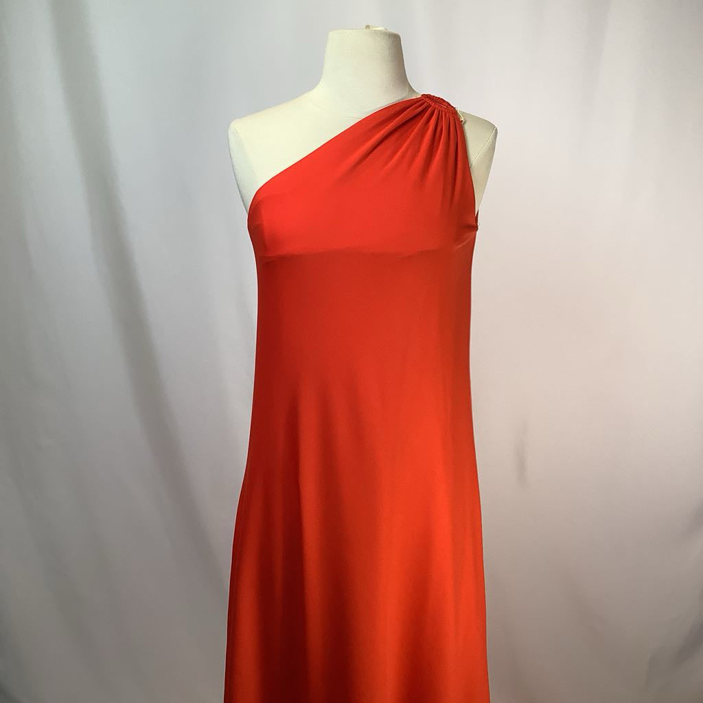 Red one-shoulder dress on a mannequin against a plain background