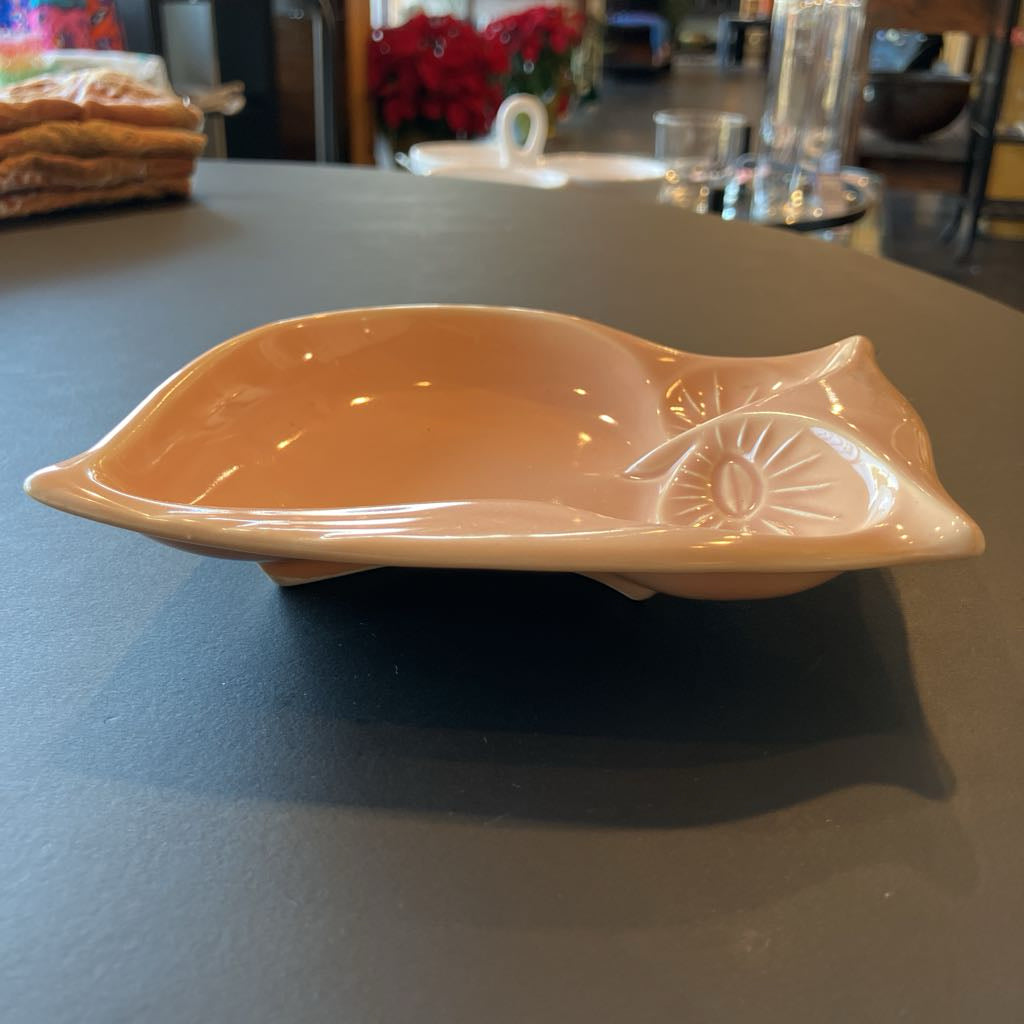 Ceramic bowl on a dark surface with a blurred background