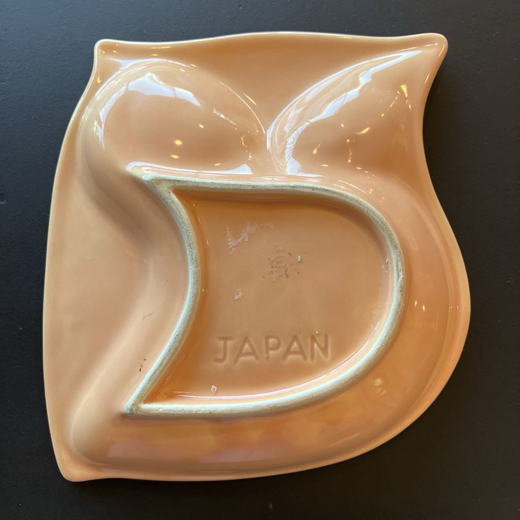 Ceramic dish with 'Japan' inscription on a dark background