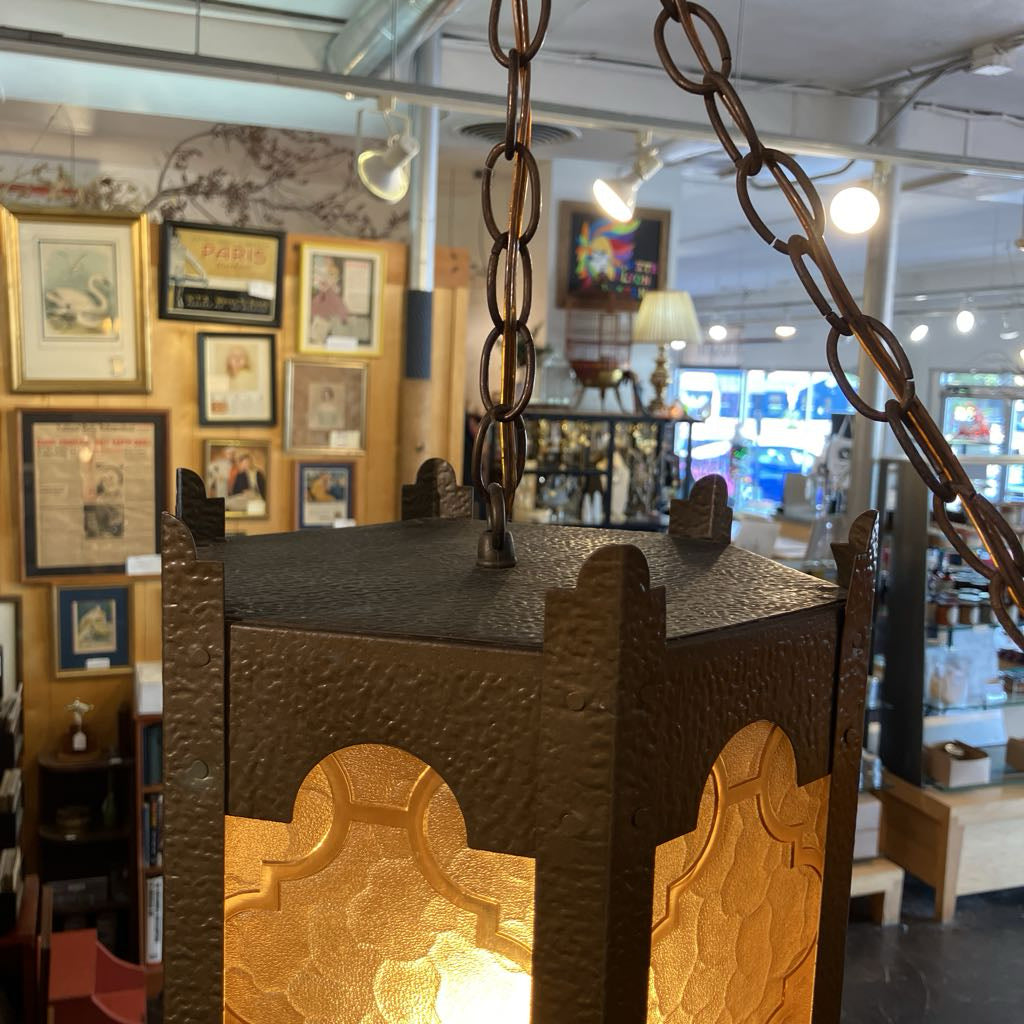 Decorative lamp with chain in a store setting
