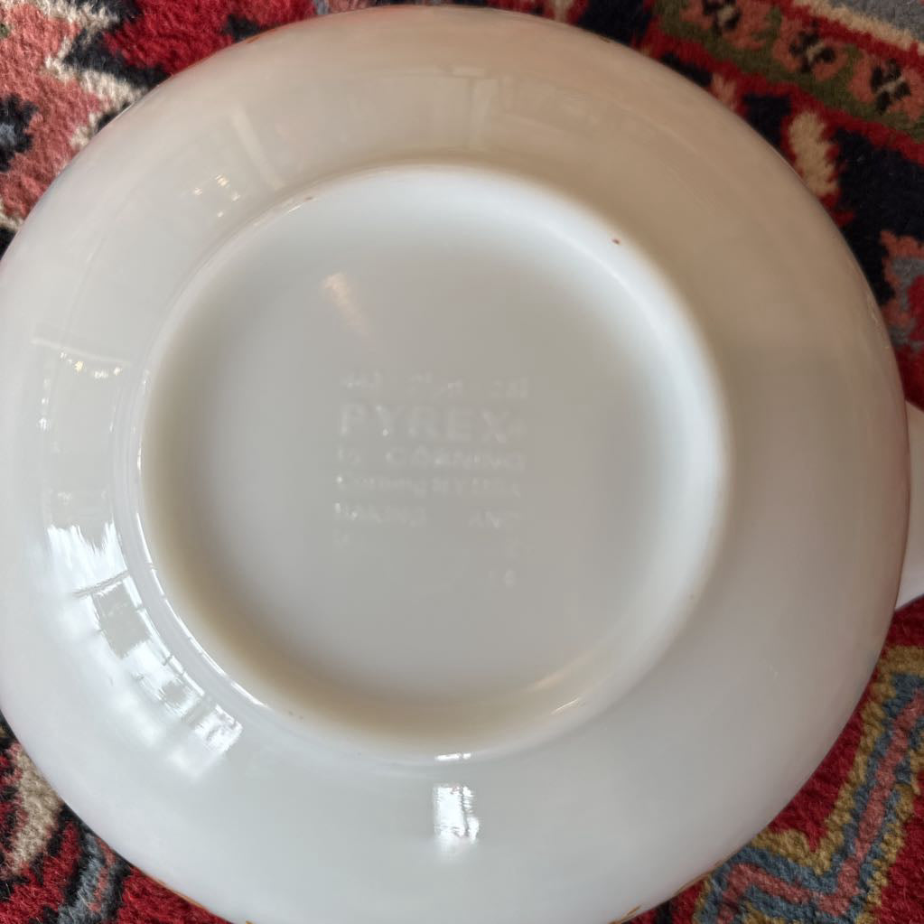 White ceramic plate on a patterned fabric background