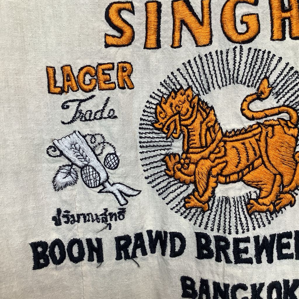 Vintage-style beer label with a tiger emblem and text on a beige background