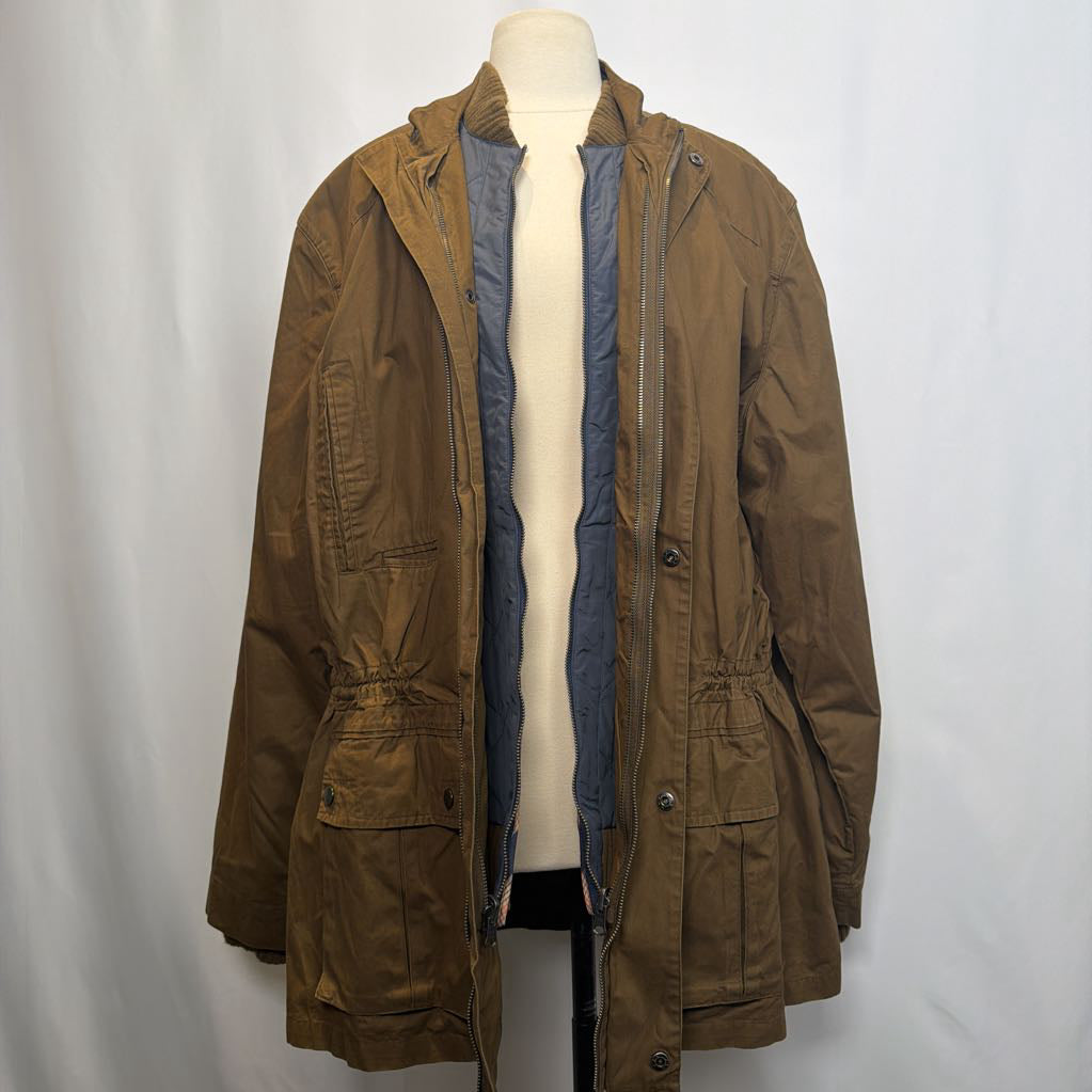 Brown jacket on a mannequin against a white background