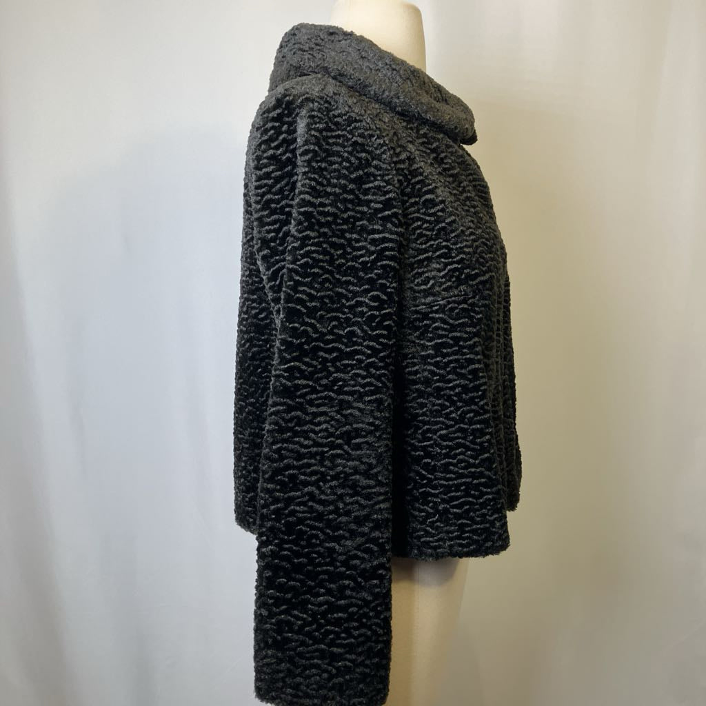 Dark gray textured coat on a mannequin against a plain background
