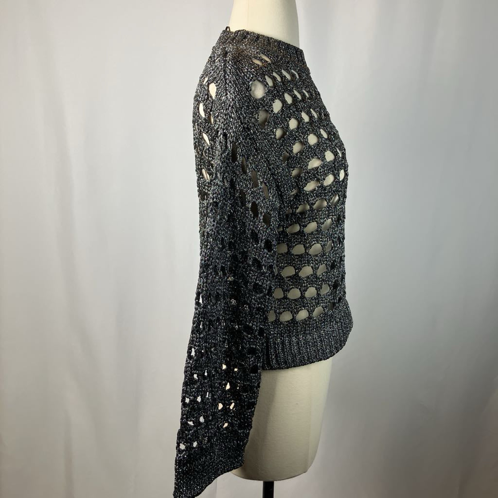 Black knit skirt on a mannequin against a plain background