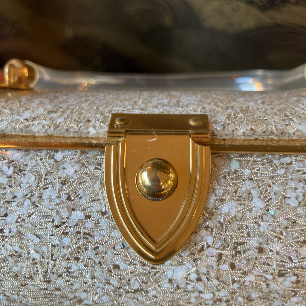 Sparkly handbag with a gold clasp