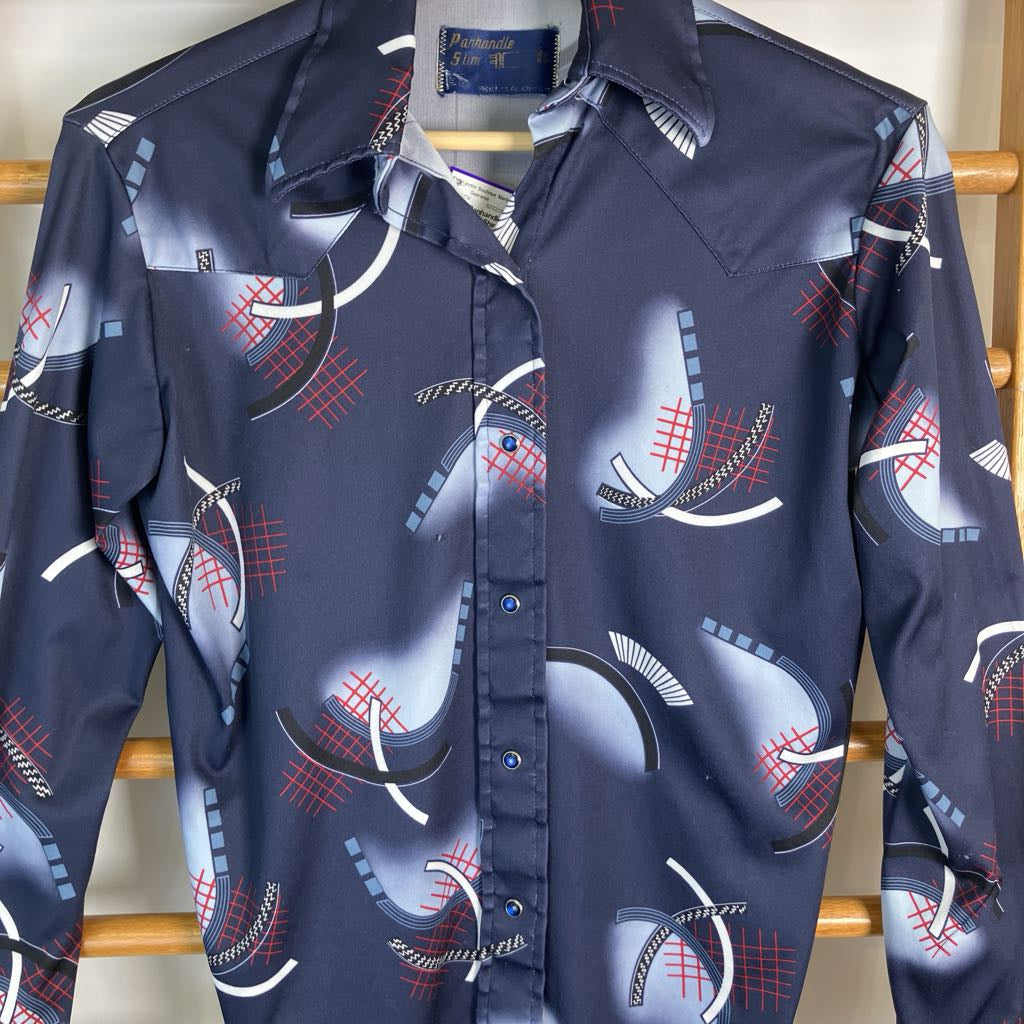 A long-sleeve button-up shirt in navy blue with a graphic print of stylized golf clubs and red grid patterns, hanging on a wooden hanger.