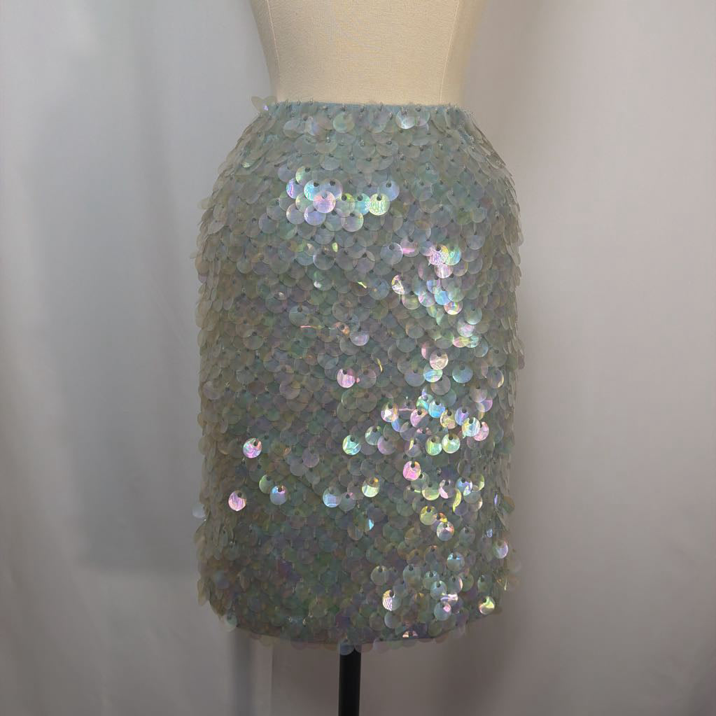 Sequined skirt on a mannequin against a plain background