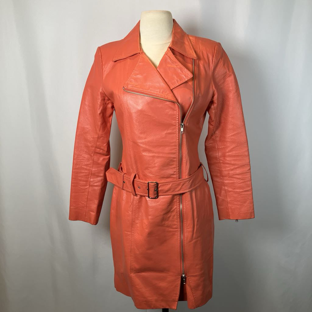 Orange leather trench coat on a mannequin against a plain background