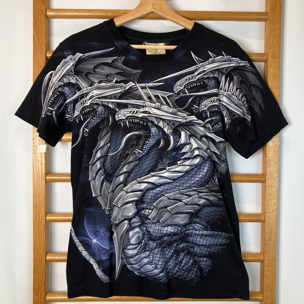 Black t-shirt with silver dragon design on a wooden hanger