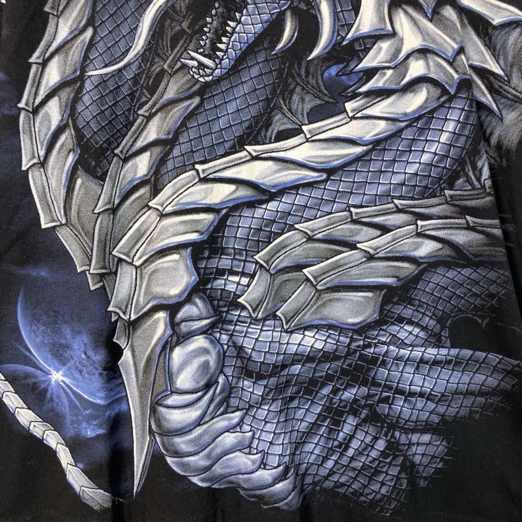 up close of design on shirt with silver and blue