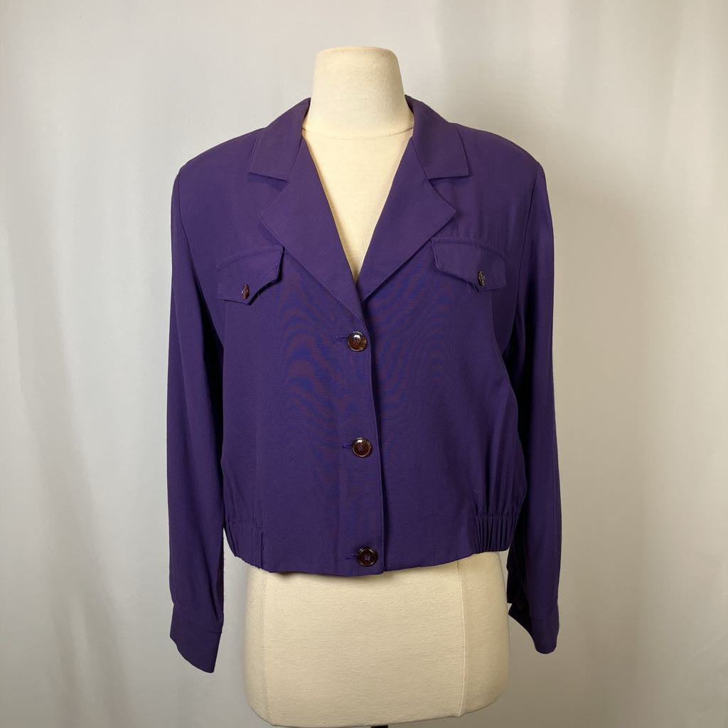 Purple jacket on a mannequin against a plain background