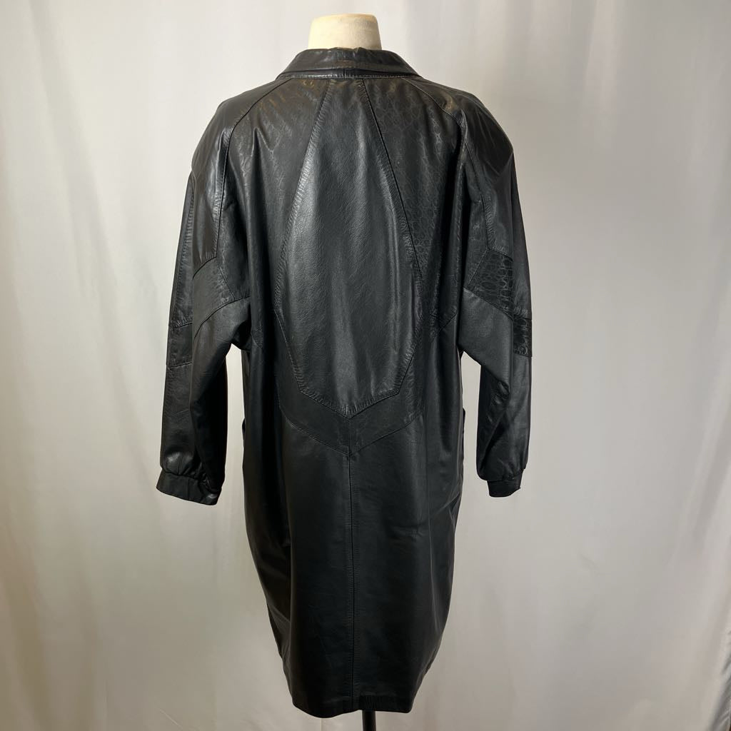 Black leather coat on a mannequin against a plain background