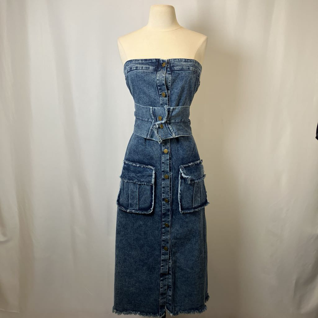 Denim dress on a mannequin against a plain background
