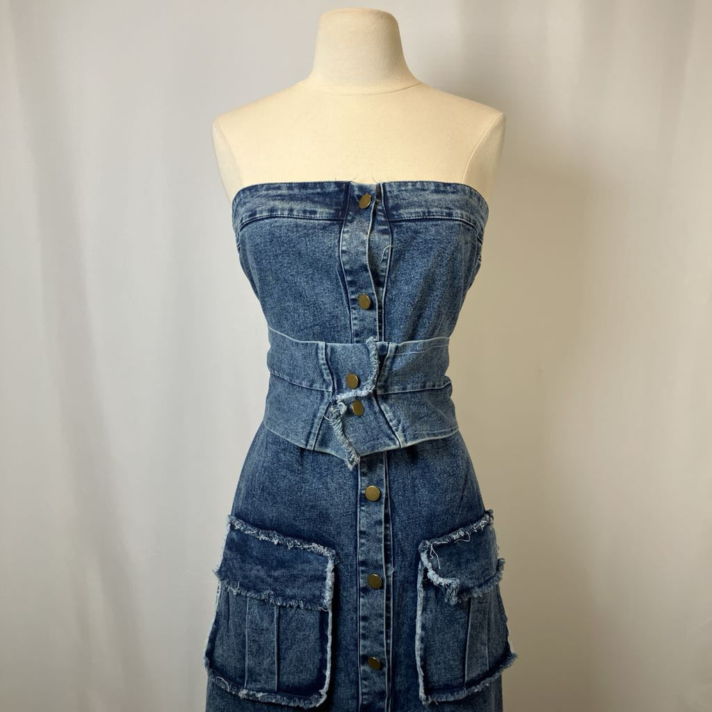 Denim dress on a mannequin against a plain background