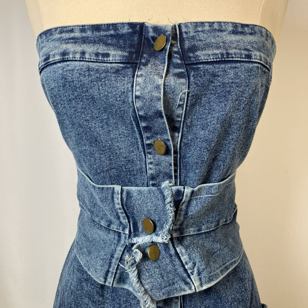 Blue denim corset-style garment on a mannequin with a neutral background