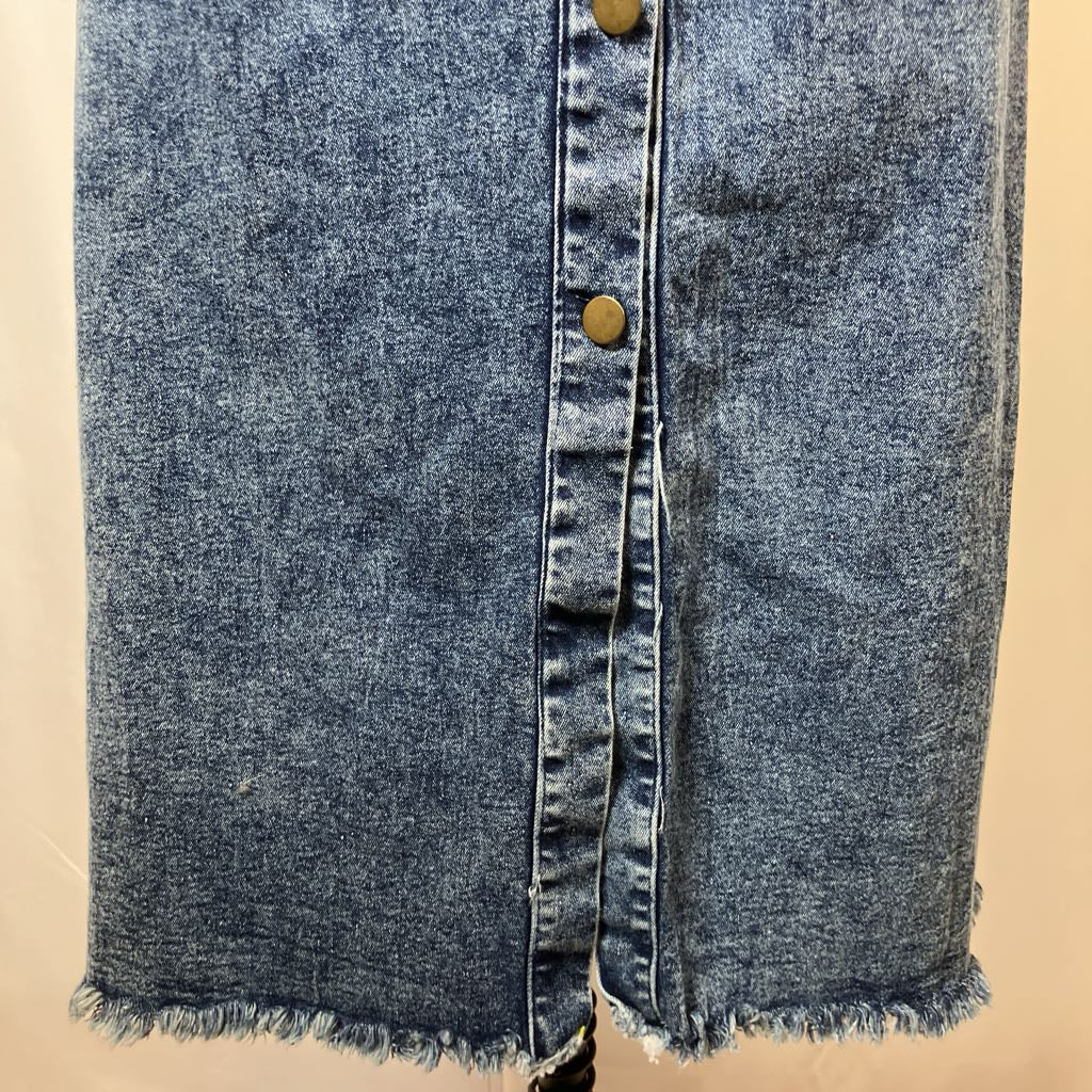 Blue denim jacket with button details on a beige background