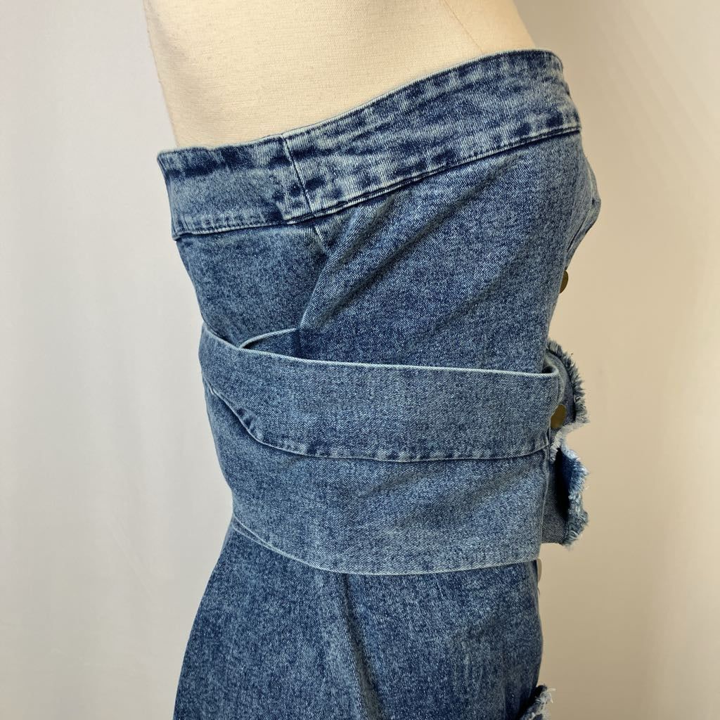 Mannequin wearing a blue denim skirt with a plain background