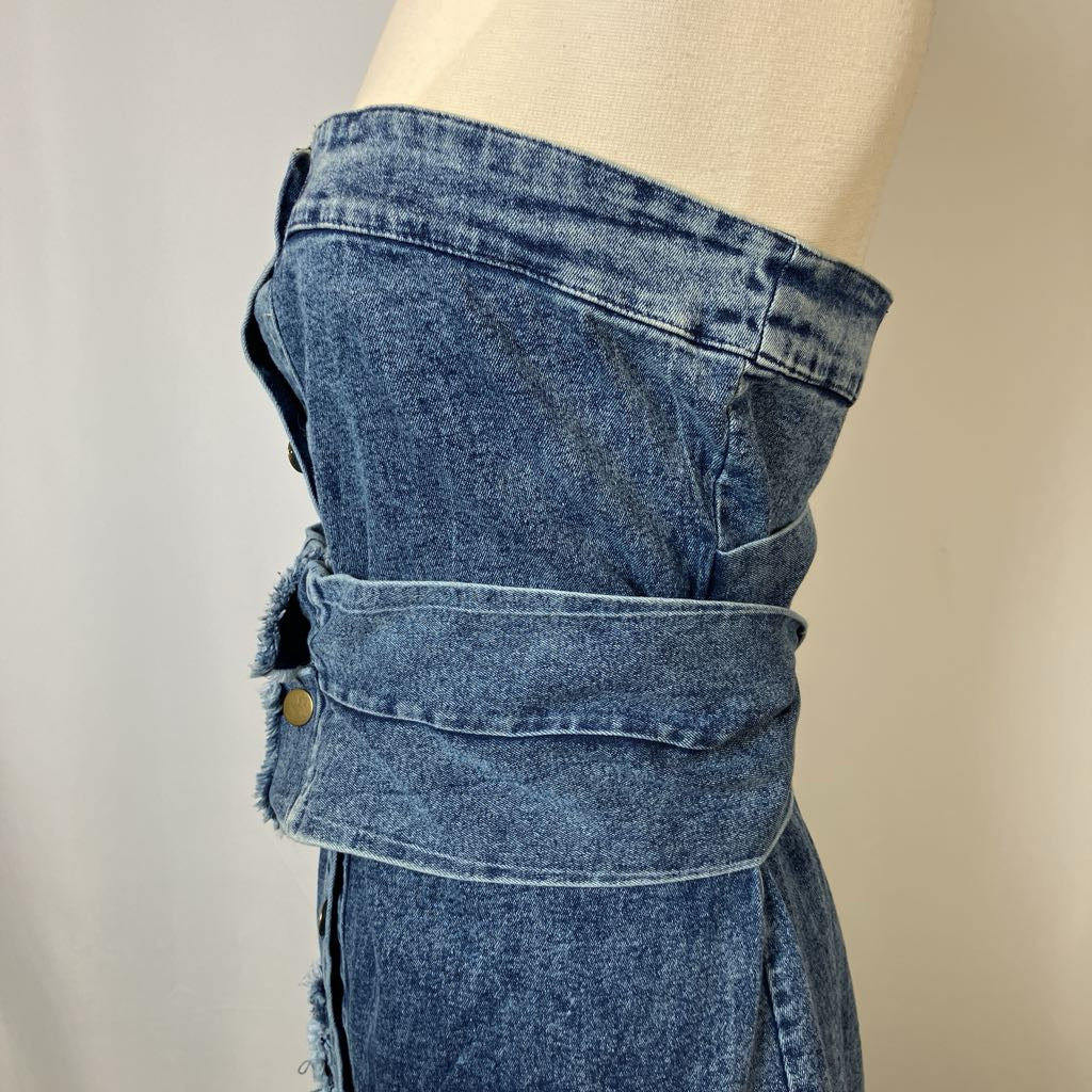 Blue denim skirt on a mannequin against a neutral background