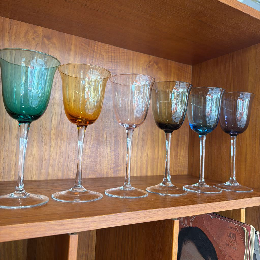 Multicolor Glasses against a wooden background