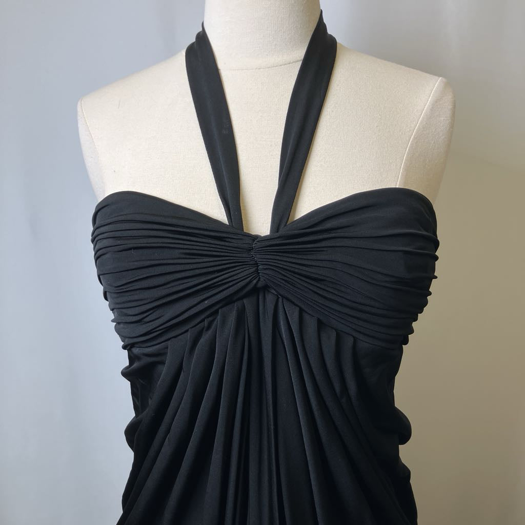 Black halter neck dress on a mannequin against a neutral background