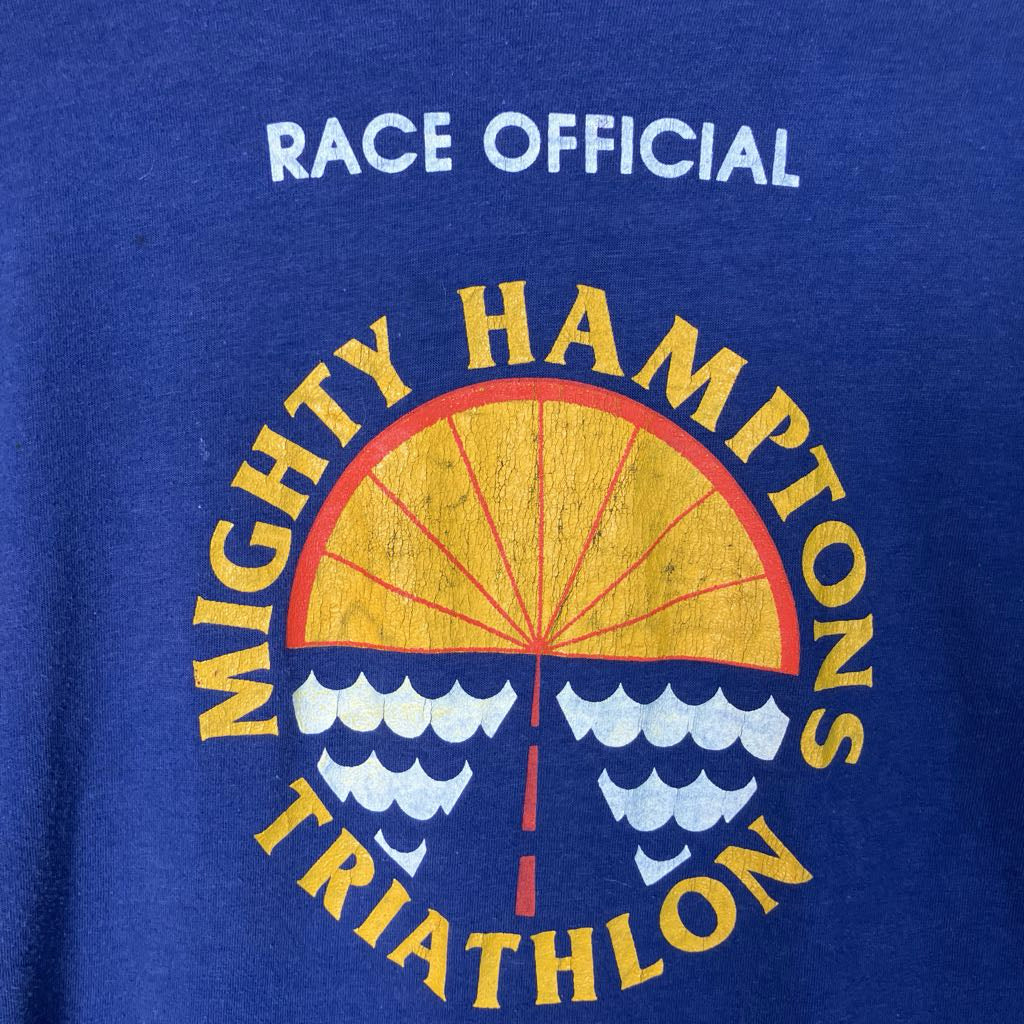 Blue t-shirt with 'Mighty Hampions Triathlon' logo and 'Race Official' text.