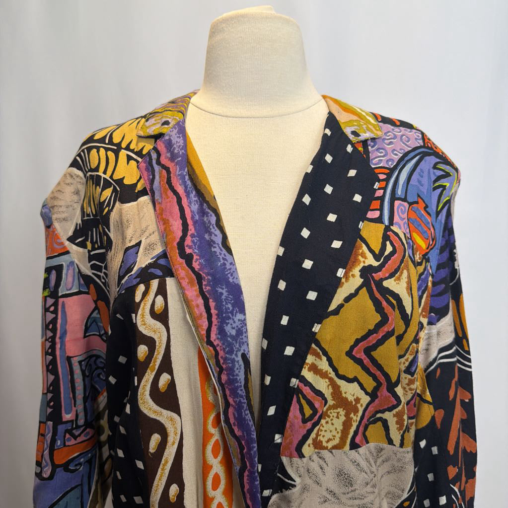 Colorful patterned jacket on a mannequin against a plain background