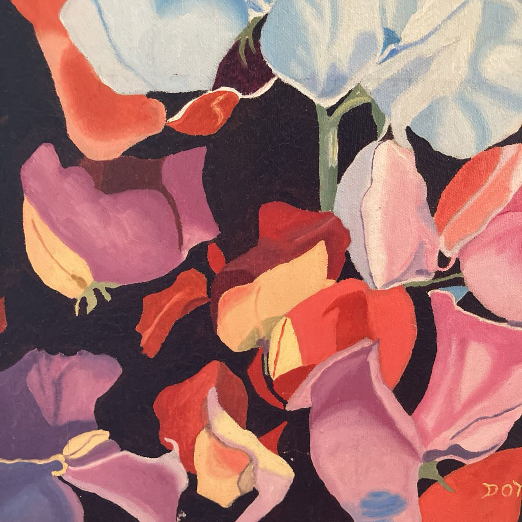 Close-up of colorful floral pattern with 'DOT' initials.