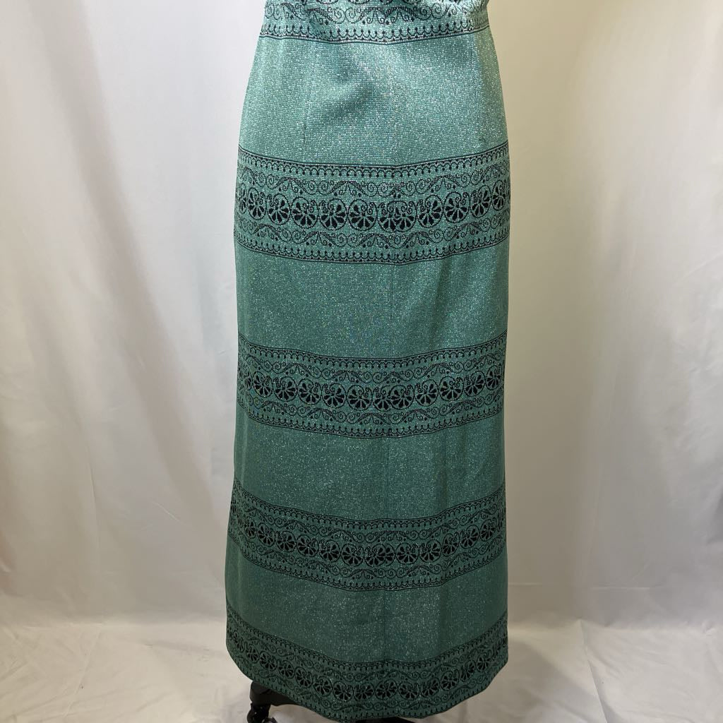 Green skirt with lace detailing on a white background