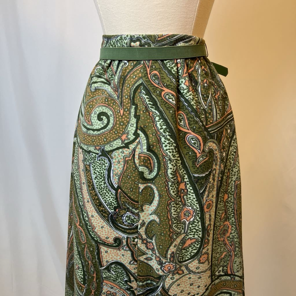 Patterned skirt on a mannequin against a plain background