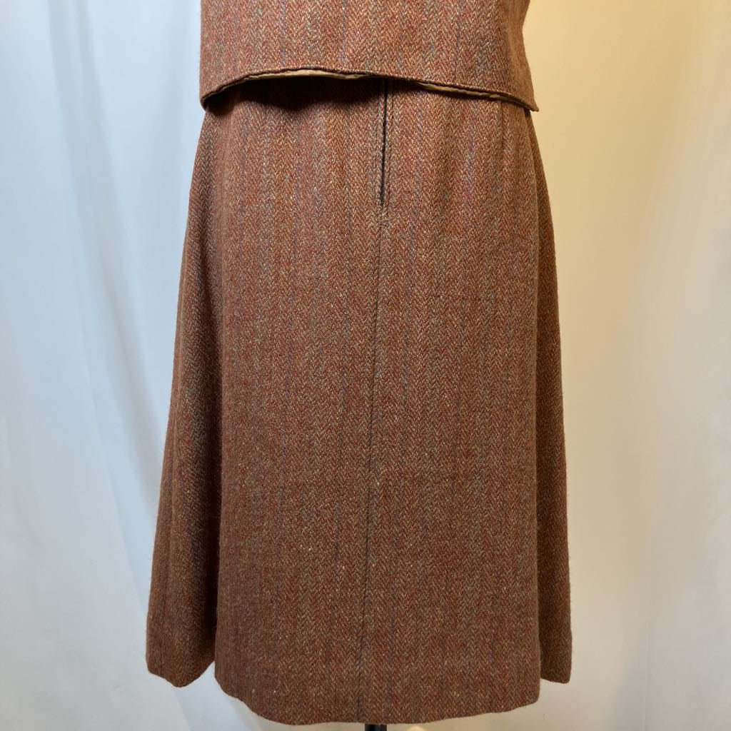 Brown skirt on a mannequin against a plain background