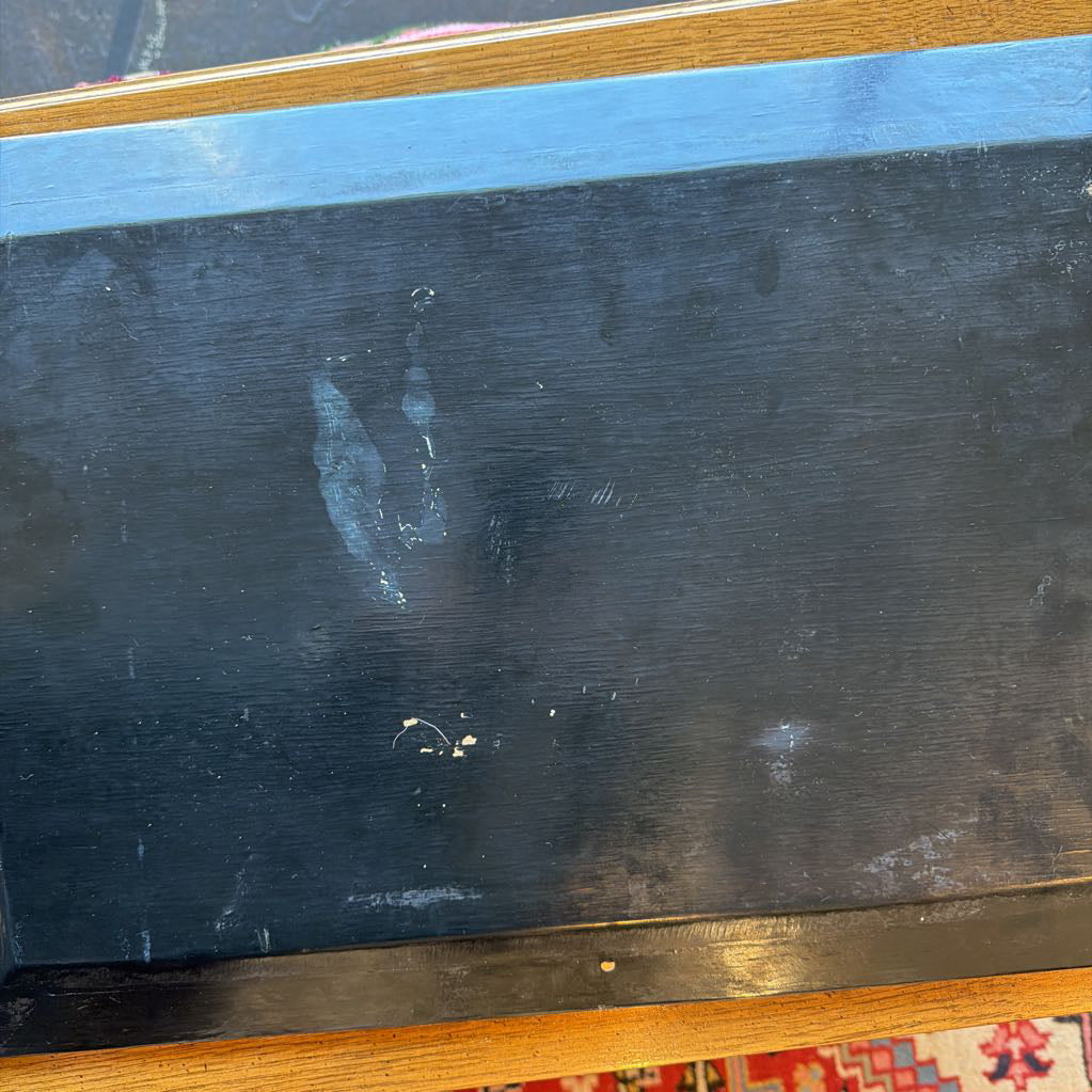 Scratched black surface with wooden edges