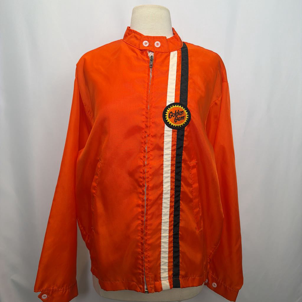 Orange jacket with a brand logo on a mannequin against a white background