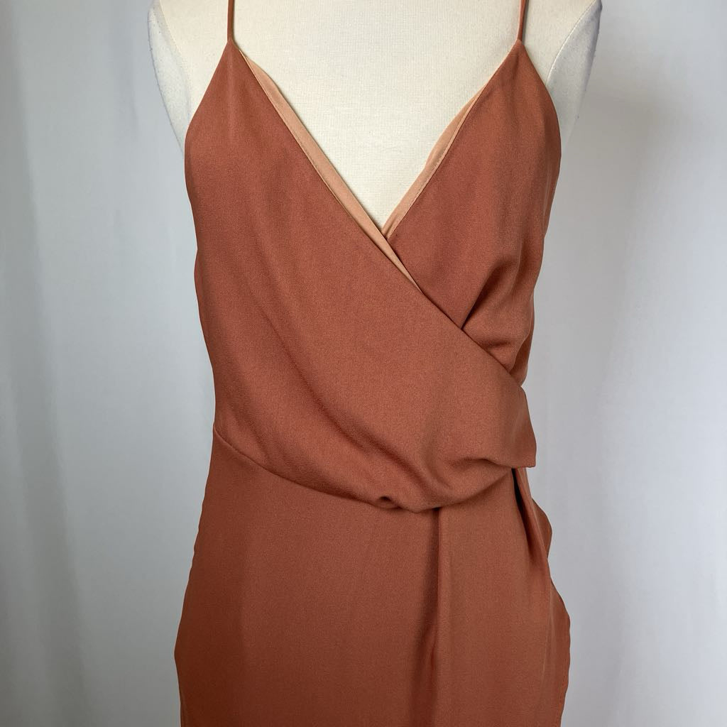 Brown dress on a mannequin against a plain background