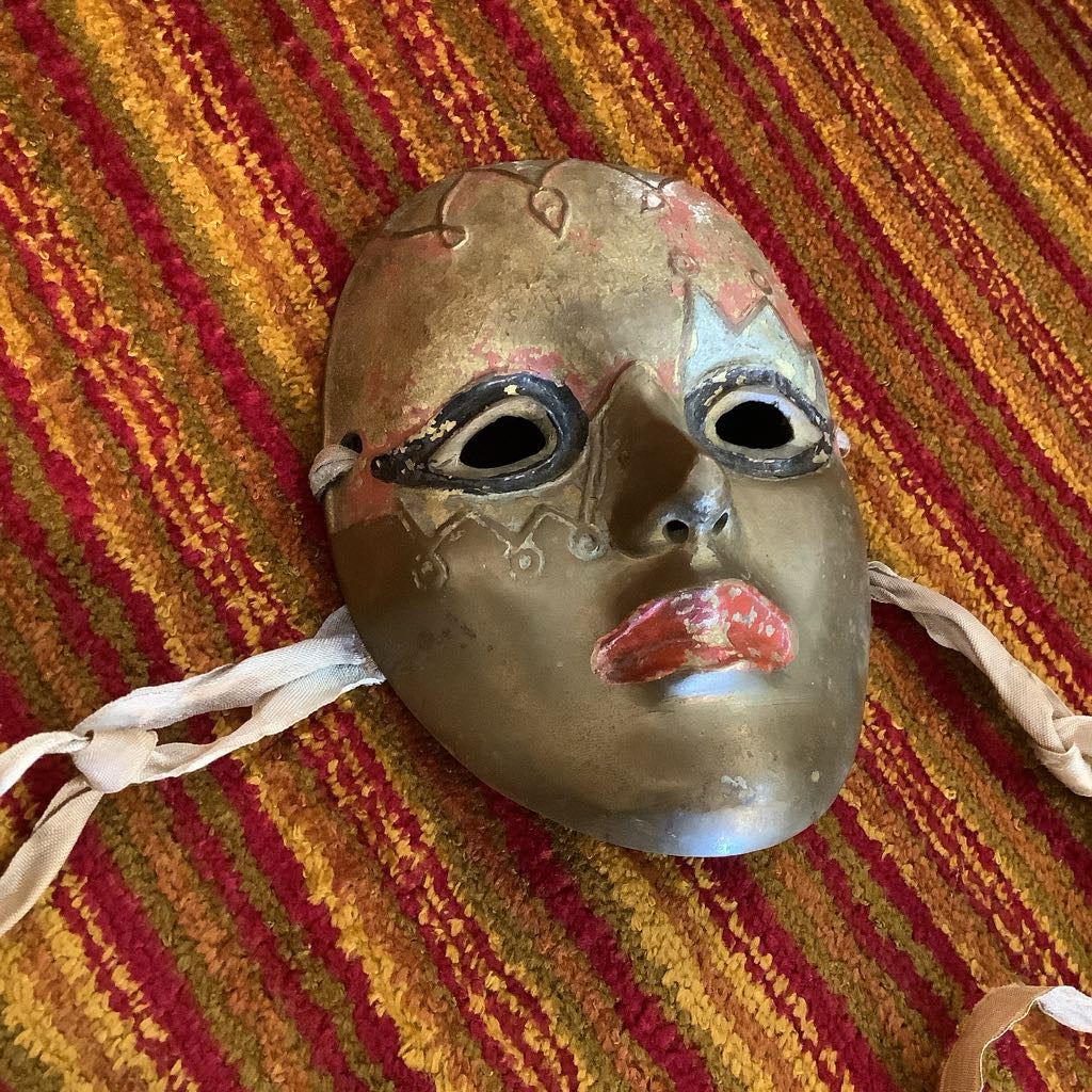 Vintage mask on a striped fabric background
