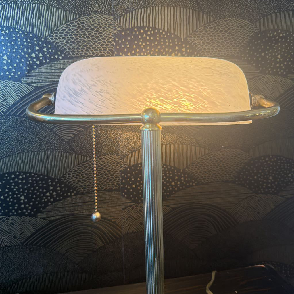 back of lamp in front of wallpaper