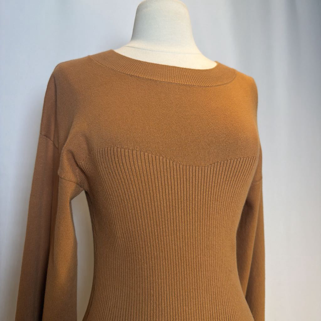 Brown sweater on a mannequin against a plain background