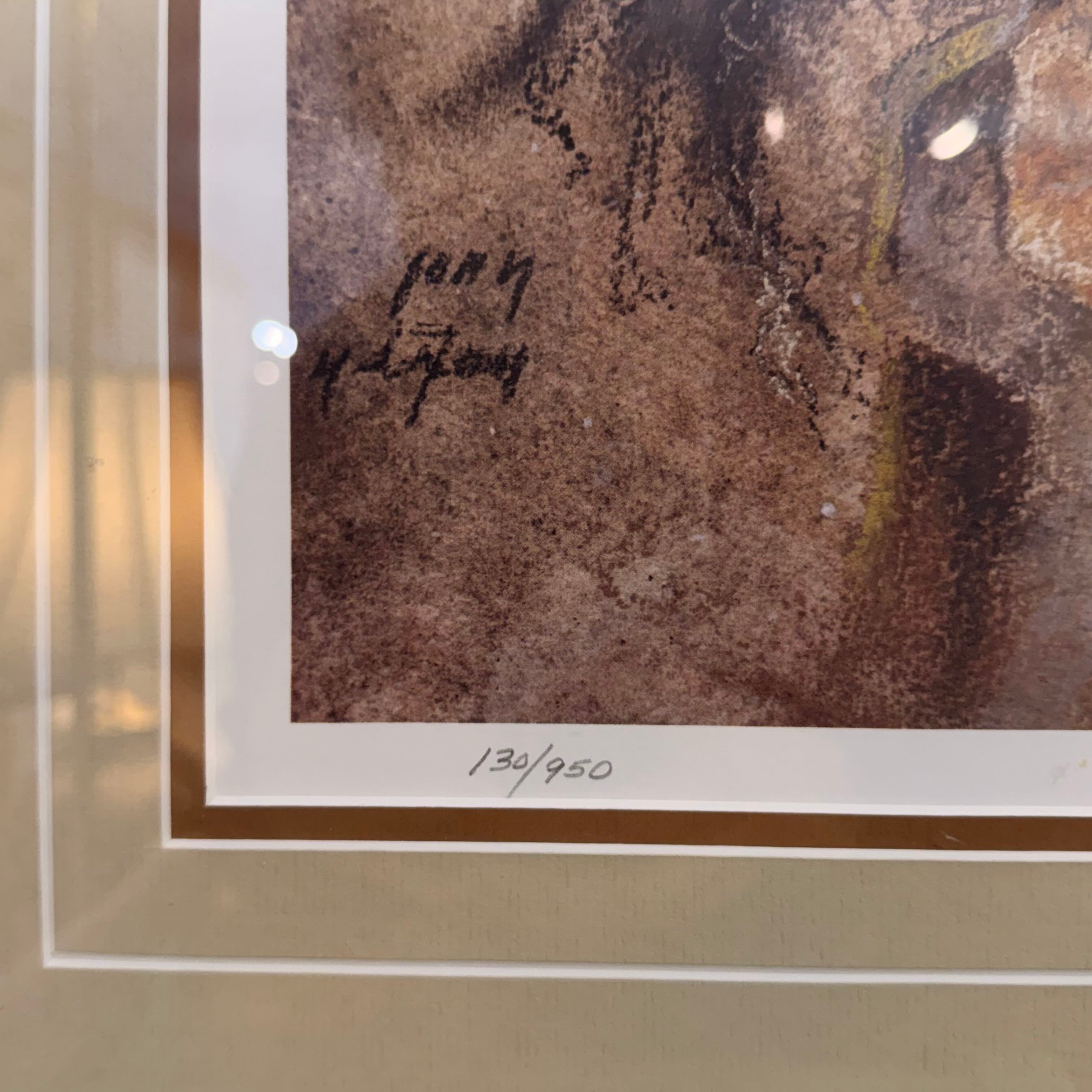 Framed artwork with a signature and edition number on a textured background