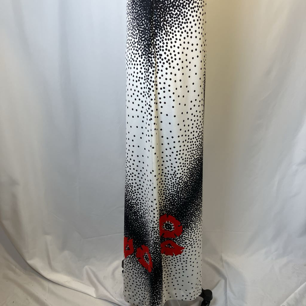 Black and white polka dot scarf with red floral ends on a white background