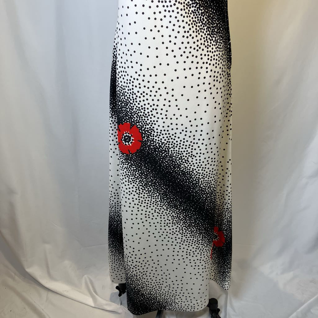 Black and white polka dot skirt with red floral accents on a white background