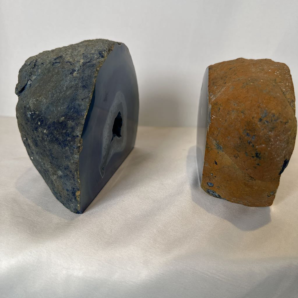 Two geological samples, one blue and one brown, on a white background