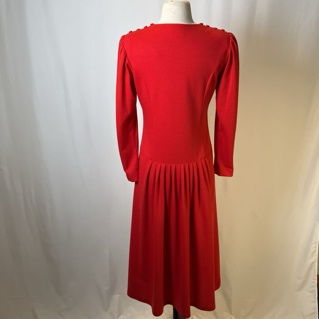 Red dress on a mannequin against a white background